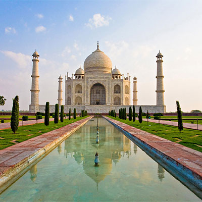 The taj mahal picture which is located in india along with the reflection of the taj mahal in water
